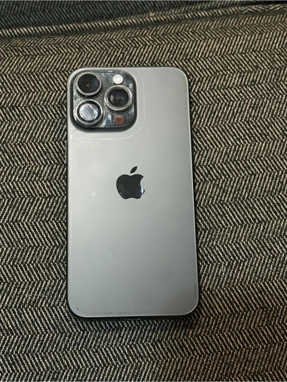 Apple Silver iPhone with Black Apple Logo and Triple Camera